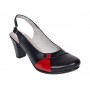 Pantofi eleganți de damă, tip slingback, cu toc gros stabil și design modern în combinație negru-roșu. Ideali pentru ținute office sau casual.